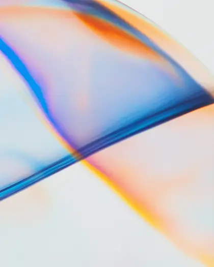 Abstract translucent waves in blue, orange, and purple hues on a light background.