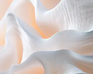 Soft flowing white translucent fabric with fine texture and warm light glow.